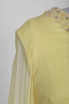 "Beautiful vintage 1970s dated 1971 yellow silk mini dress Sheer sleeves with beaded + prong set aurora borealis rhinestones Fully lined with back metal zipper Great vintage condition - pin size spot on shoulder and slight spot on skirt (see photos) overall excellent condition M e a s u r e m e n t s: Size: fits like a size S M Bust: 17 1/2\" Waist: 15\" Hips: 20\" Total length: 37\" Sleeves: 20 3/4\" Label: Ambassador Fashion HK dated Nov. 16th 1971 +All Measurements are taking while garment is Yellow Silk Dress, Dress Sheer Sleeves, Rhinestone Mini Dress, Silk Yellow Dress, Silk Dress Vintage, Yellow Silk, 1980s Dresses, Gauze Dress, Mexican Dresses