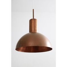 a copper colored light hanging from a ceiling