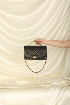 CONDITION: VERY GOOD VINTAGE .?ÿ Crafted from the finest lambskin leather, this medium Diana bag features a sleek and streamlined design with a stunning 24K gold plated chain and hardware. The black color is versatile and perfect for any occasion, while the signature Chanel diamond quilted pattern adds a touch of luxury and elegance. The spacious interior of this bag features multiple compartments, including a zip pocket, allowing you to keep all of your essentials organized and easily accessible. The adjustable chain strap can be as a single or double strap, giving you the flexibility to wear it as a shoulder bag or crossbody. Named after one of the most iconic woman in history, this bag truly carries on the history and elegance of Princess Diana. Crafted in 1991-1994 Strap drop: 20"?ÿ 10 Woman In History, Streamlined Design, Quilted Pattern, Handbag Wallet, Dior Shoes, Wallet Accessories, Iconic Women, Diamond Quilt, Girl Backpacks