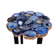 a blue and white table topped with lots of rocks