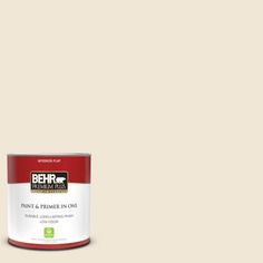 a can of behr paint and primer in one on a dark blue background