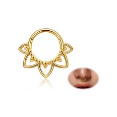 a gold nose ring with an intricate design