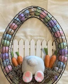 an easter wreath with bunny ears and carrots