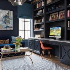 a living room filled with furniture and a flat screen tv