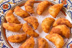 some fried food is on a plate and ready to be eaten