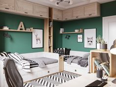 a bedroom with green walls and black and white decor on the bed, bookshelves