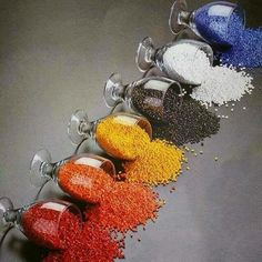 there are many different types of spices on the table together, including red, white and blue