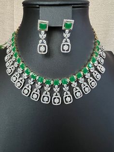 Green Emarald Designer AD Stones/ Premium Quality Necklace Light Weight Necklace and Earring Set/micro gold/South Indian jewelry This item is perfect for parties and festivals! DETAILS: Includes One Choker necklace and two earrings.  Necklace: 13.4 inches. 17 total Extra Chain Lincks will Add Adjustable length. Chain closure. Weighs 1.95 oz (55 g).  Earrings: 1.4 inch(es) long. Earring set weighs 0.20 oz ( 6g) Earring backs push on/off. Material: Imitation Gold Polish Green Emerald, and American Diamond Stone. Finish: Premium GJ gold finish.  NOTE: I try my best to show you photos of my products as they appear in real life, but please note that variations in color occur due to differences in lighting and screen settings.  PRODUCT CARE: - Avoid contact with heat/fire, water, and chemicals s Green Gold Plated Jewelry Set As A Gift, Green Gold Plated Jewelry Set For Gift, Gold Plated Green Emerald Necklace, Hand Set Green Jewelry Sets For Anniversary, Green Gold-plated Jewelry Set For Gift, Green Round Gold Plated Emerald Necklace, Green Emerald Necklace Hand Set For Party, Hand Set Green Necklace For Anniversary, Round Green Emerald Gold Plated Necklace