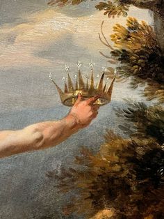 a painting of a hand holding a crown