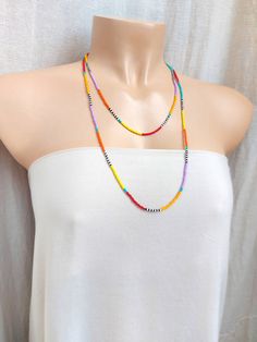 "This is a one strand beaded multi color necklace or bracelet, with NO CLASP, and can be worn in multiple ways, as shown in pictures. ❤ SIZES This item is one size fits all. ❤ PROCESSING AND SHIPPING Most orders are made and shipped out in one business day. Please check delivery timeframes for your location on the description below. ❤ CUSTOM ORDERS If you like this item in a different color, send me a message indicating: color, size and quantity needed. I will send you a link for a \"custom orde Red Beaded Necklaces For Summer, Summer Red Necklaces With Colorful Beads, Summer Red Necklace With Colorful Beads, Colorful Beads Long Necklace For Summer, Red Tiny Beads Necklace For Summer, Summer Long Necklace With Colorful Beads, Summer Red Necklace With Beaded Chain, Bohemian Orange Beaded Chain Necklace, Summer Red Beaded Necklaces With Colorful Beads