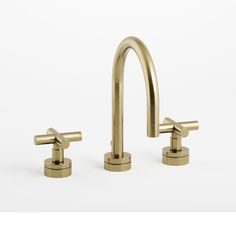 two brass faucets, one is turned on and the other has no handles