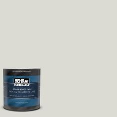 a can of behr paint on a white background