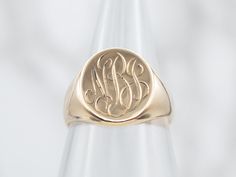 The engraving on this ornate antique signet ring was so well done, we opted to leave it be, and hope that we found someone with the initials "NBJ" who loves it as much as we do!Signet rings have a long history. Originally carved with a Family Crest, they were used to seal letters and documents by embossing the crest in wax. Over time they have evolved into day-to-day jewelry, which can be engraved with any crest, monogram, or initial one desires.Please note that this signet ring has its original monogram, unfortunately, this piece cannot be altered without affecting the quality of the piece, please feel free to contact us to help you find your perfect signet ring in your style and budget! Metal: 14K Yellow GoldTop Measurements: 11.2 x 14.2 mm, OvalMonogram: "NBJ" in French ScriptRing Size: Crest Monogram, Gold Lion, Signet Rings, Gold Signet Ring, Gold Art Deco, Long History, Gold Top, Antique Roses, Gold Filigree