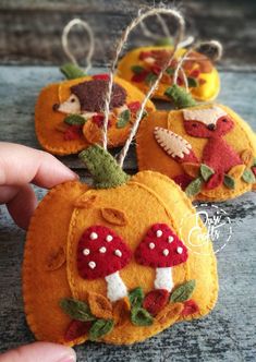 handmade pumpkins with mushrooms and leaves on them