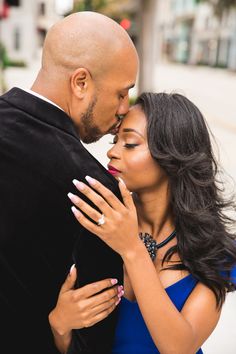 a man and woman embracing each other on the street