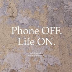 the words phone off, life on are written in white over an old stone wall