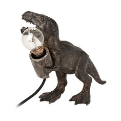 a toy dinosaur with a light bulb in it's mouth