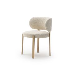 a white chair with gold legs and a beige seat cover on it's back