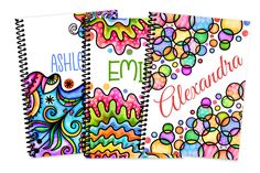 two spiral notebooks with colorful designs and the words'emo arenadaa '