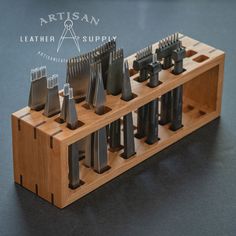 an assortment of different types of knives in a wooden holder