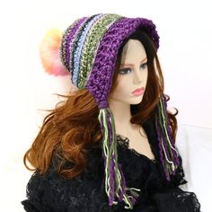 Make winter fun with this thick warm Fairy pom pom stocking hat. I've crocheted this in purples and greens with a rainbow pom pom on top. The ribbed brim is split towards the back to leave room for thicker hair, and you can adjust the brim to sit back, down, or out. The ties are left natural for extra character. The pom pom is securely attached with elastic wrapped around a button on the inside, and can be removed for washing. Soft and certain to add a touch of fun to your outdoor wear or gift t Rainbow Pom Pom, Snow Hat, Ski Hat, Stocking Hat, Thicker Hair, Ski Hats, Slouchy Beanie, Fabric Tape, Pom Pom Hat