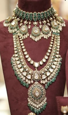 an elaborate necklace and earrings on display