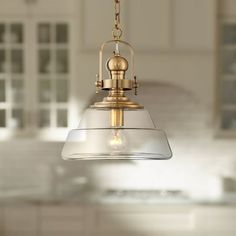 a light fixture hanging from the ceiling in a kitchen