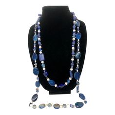 This stunning necklace measures 35 inches and features blue lapis lazuli, complemented with pearls, crystals, and iridescent stones. According to the Sumerians, the lapis lazuli stone housed the spirit of their gods, while the ancient Egyptians regarded it as a representation of the night sky. Lapis lazuli has always been connected to qualities such as strength, courage, intelligence, truth, royalty, and wisdom since ancient times. This necklace can brighten up any room with its bedazzling sparkle. Wrap it three times with the lighter-colored stones at the bottom. Bohemian Lapis Lazuli Beaded Necklaces For Gift, Adjustable Bohemian Lapis Lazuli Beaded Necklace, Bohemian Lapis Lazuli Beaded Necklaces, Luxury Lapis Lazuli Faceted Beads Necklace, Bohemian Lapis Lazuli Hand-strung Necklaces, Ancient Egyptians, Blue Lapis Lazuli, Fair Lady, My Fair Lady