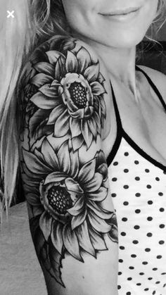 a woman with a sunflower tattoo on her arm