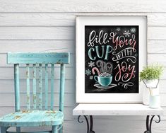 a chalkboard sign that says, all your cups with joy on it next to a chair and potted plant