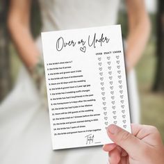 a person holding up a wedding order card