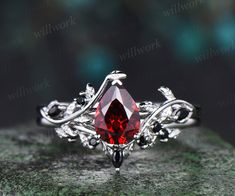 ***It's all about harmony and romance. The red garnet ring set will represent your tender feelings and serious intentions in the best way. It features a flowing design with naturally wrapped leaves. Handcrafted from solid gold this engagement ring set features detailed leaves and organic lines wrapped around the central gemstone.***- Metal: Solid gold(10K/14K/18K white/yellow/rose gold),925 sterling silver,platinum available- Main Stone: 6x8mm pear-cut natural garnet.- Accent Stone: black spinel Trillion Earrings, Garnet Engagement Ring, Red Garnet Ring, Organic Lines, Bridal Ring Sets, Garnet Ring, Leaf Ring, Engagement Ring Set, Black Spinel