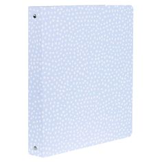 a blue binder with white dots on it