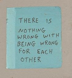 there is nothing wrong with being wrong for each other written on a blue piece of paper