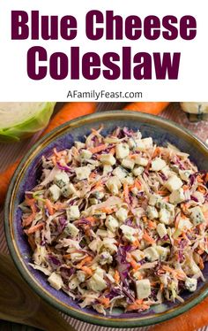 a bowl filled with coleslaw next to carrots and cabbage