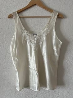 100% polyester Best fits size M-L White Silk Summer Tops, Fitted Cream Satin Top, Cream Fitted Satin Top, Sleeveless Cream Silk Top, Chic Cream Satin Top, Elegant Cream Satin Top, Feminine Silk Cream Top, Cream Silk Feminine Top, Feminine Cream Silk Top