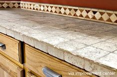 a kitchen counter top with drawers underneath it