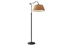 a floor lamp with a brown shade on the base and a white light behind it