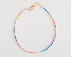 Dainty Rainbow Ombre Seed Bead Choker Necklace Rainbow Beaded Necklace Stackable Seed Bead Necklace Tiny Rainbow Ombre Necklace - Etsy Adjustable Rainbow Single Strand Beads, Adjustable Single Strand Rainbow Beads, Adjustable Rainbow Beaded Necklaces For Summer, Rainbow Tiny Beads Necklace For Summer, Summer Rainbow Beaded Necklaces With Tiny Beads, Rainbow Tiny Beads For Summer, Trendy Rainbow Necklaces With Tiny Beads, Summer Rainbow Heishi Beads Jewelry, Summer Rainbow Necklaces With Tiny Beads