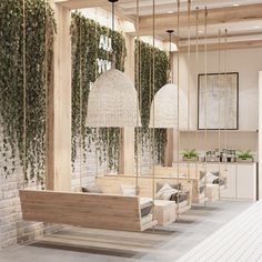 a room filled with furniture and hanging plants