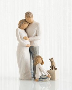 a figurine of a man and woman hugging