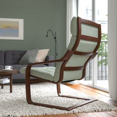 a living room scene with focus on the chair and coffee table in the foreground