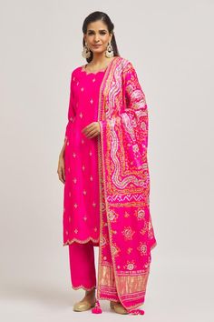 Rani pure spun silk kurta with gota and mirror hand embroidery. Comes with pant and a pure organza dupatta.
Components: 3
Pattern: Hand embroidered
Type Of Work: Gota, Mirror
Neckline: Scalloped Neck
Sleeve Type: Three quarter
Fabric: Pure satin organza
Color: Pink
Other Details: 
Side slits on kurta
Embroidered borders on dupatta
Occasion: Mehendi and Haldi - Aza Fashions Scalloped Mirror, Kurta Pant Set, Silk Kurta, Organza Dupatta, Kurta With Pants, Pant Set, Aza Fashion, Sleeve Type, Three Quarter