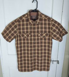 Kuhl Pearl Snap Button Shirt Small Brown Plaid Short Sleeve Outdoor Collar Marks. ____________________________________________________ GENERAL NOTE PLEASE READ: Most items I sell are Pre-owned, pre-loved and pre-worn. This means that these items will shown normal signs of gentle use  that I will try to document as best I can in the following paragraph. Please read the condition legend below to get the most accurate representation of the item you're purchasing. ___________________________________ Casual Brown Short Sleeve Shirt With Buttons, Brown Fitted Casual Short Sleeve Shirt, Casual Brown Fitted Short Sleeve Shirt, Fitted Brown Short Sleeve Casual Shirt, Brown Tops With Button Closure For Outdoor, Brown Outdoor Shirt With Button Closure, Brown Shirt With Button Closure For Outdoor, Vintage Style Tops With Button Closure For Outdoor, Wicked Musical