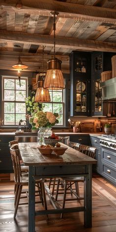 a rustic kitchen with blue cabinets and wooden table in the center, surrounded by wood flooring