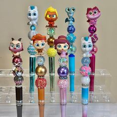 the littlest pet shop characters are all lined up in their own pen holders,