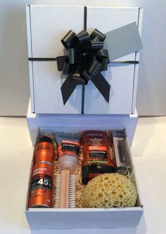 an open gift box with various items in it