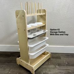 an open wooden storage station with bins and trays on it's sides