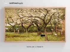 the painting is hanging on the wall in front of the white wall and there is a black dog sitting under the blossoming tree