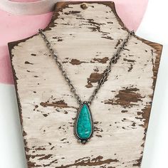 This large teardrop pendant is the perfect size to layer with with your favorite Navajo Pearls! It has a silver circle chain. This necklaces is adjustable up to 18 inches. The bar is 2 inches long and 1 inch wide. SKU: #0118-2213 *This item is dyed and may come off with oil, sweat, etc. onto skin or clothing. * Turquoise Teardrop Pendant Necklace, Turquoise Teardrop Pendant Jewelry, Bohemian Teardrop Turquoise Necklace Nickel Free, Adjustable Teardrop Turquoise Necklace, Nickel-free Teardrop Turquoise Bohemian Necklace, Bohemian Teardrop Necklace With Adjustable Chain, Chained Necklace, Circle Chain, Navajo Pearls